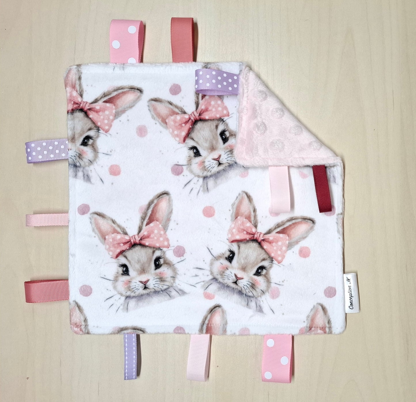 Craquante Lapins boucles rose à pois